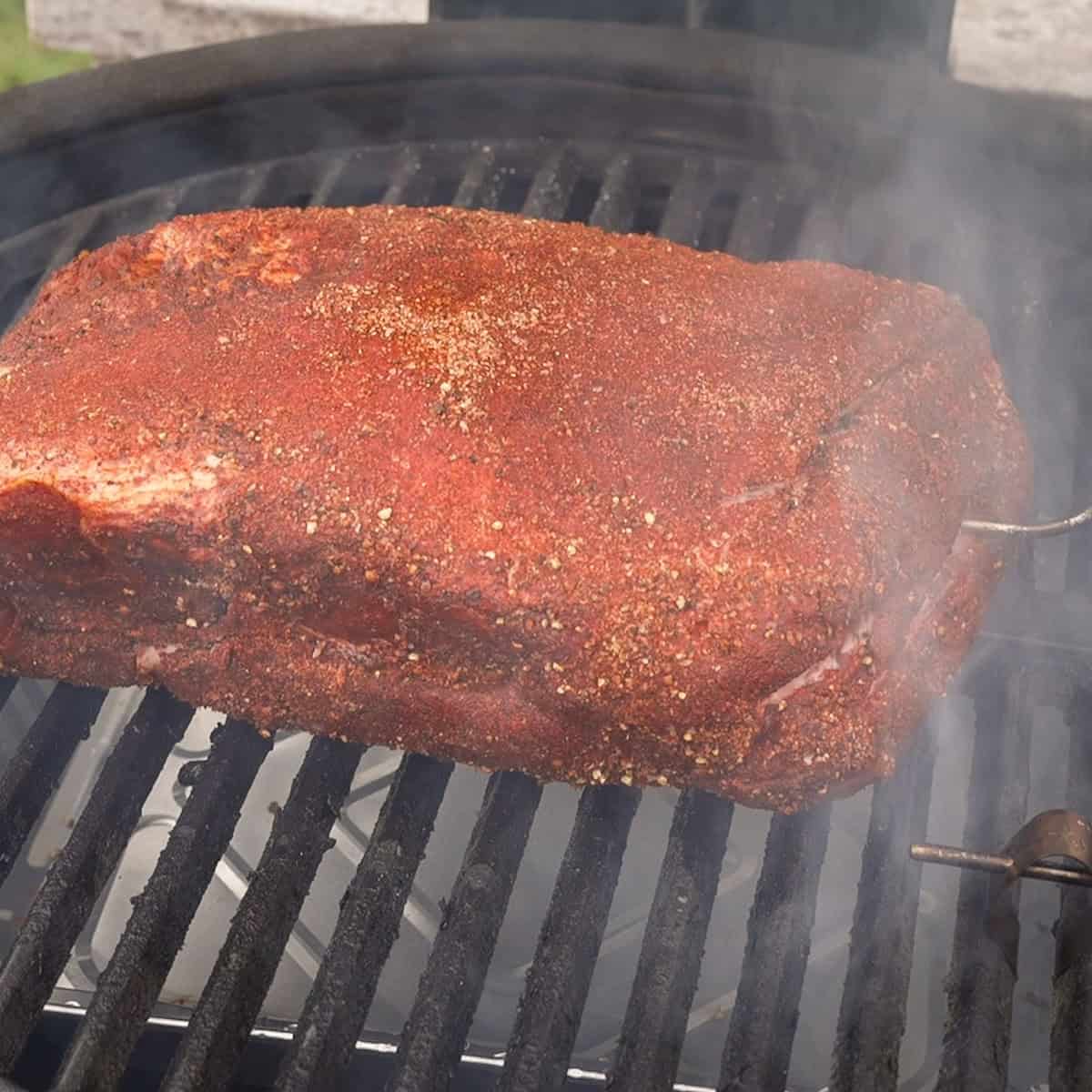 Place the roast in the smoker.