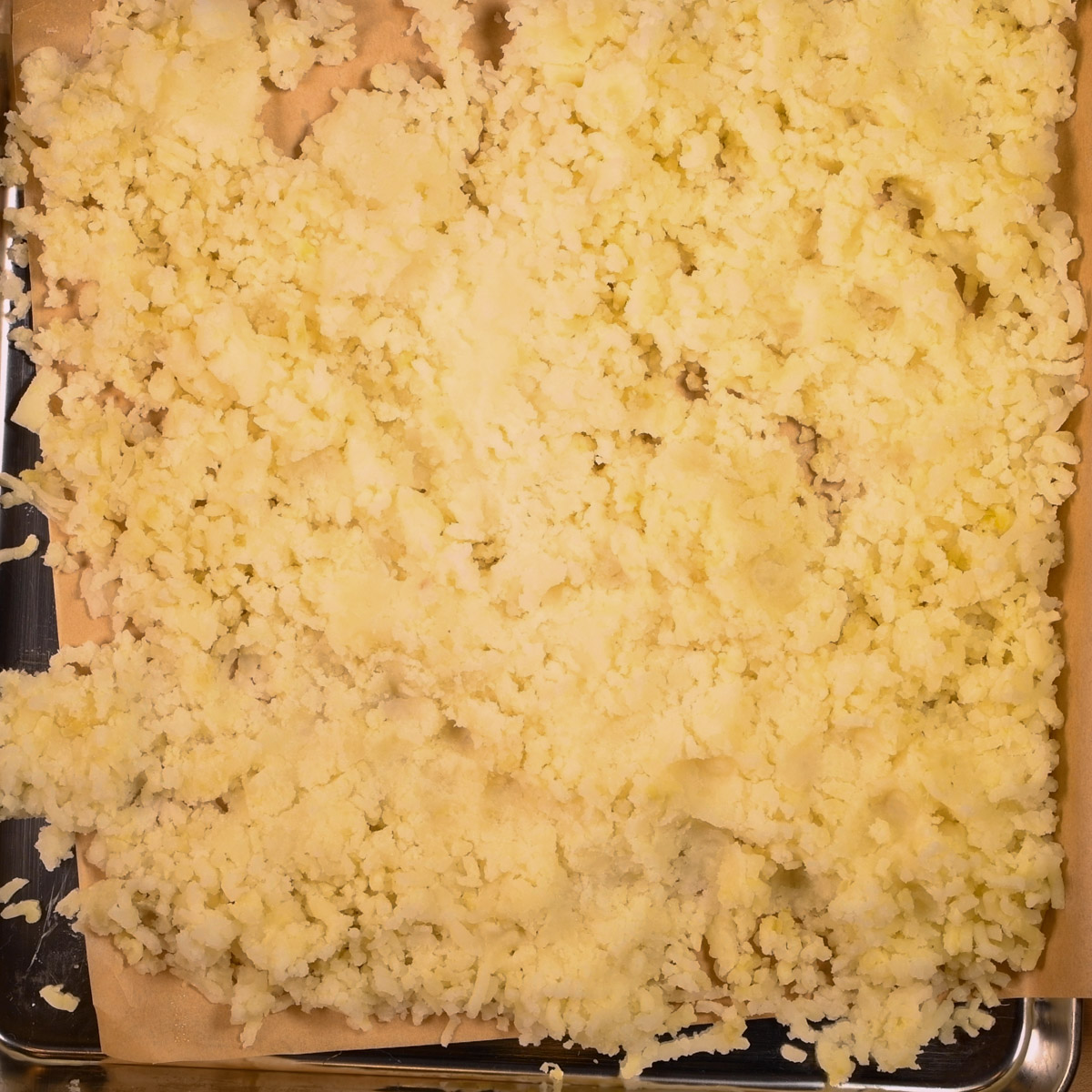 Process the baked potatoes through a ricer.