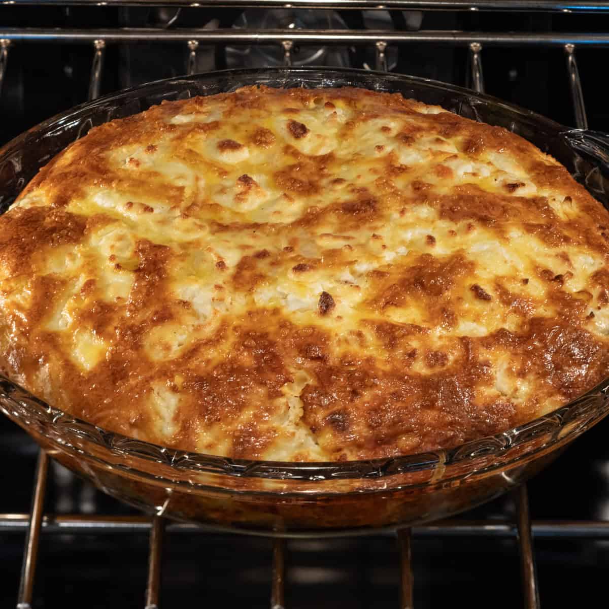 Quiche baking in oven.