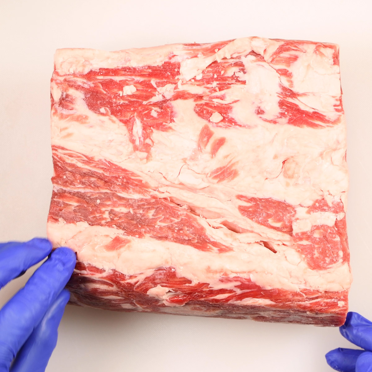 Raw prime rib roast.