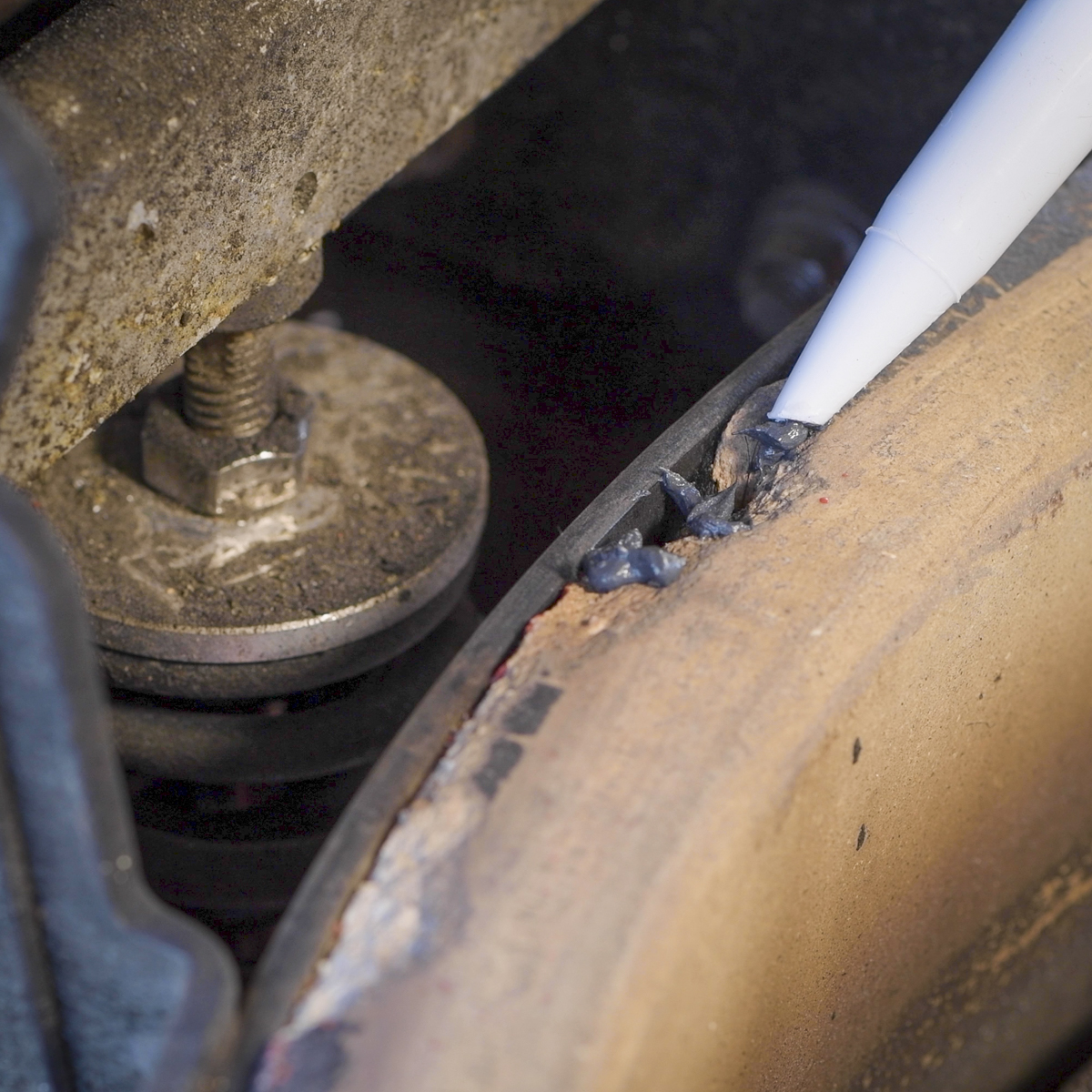 Apply a thin coat of high-heat mortar to hole left by the chip.