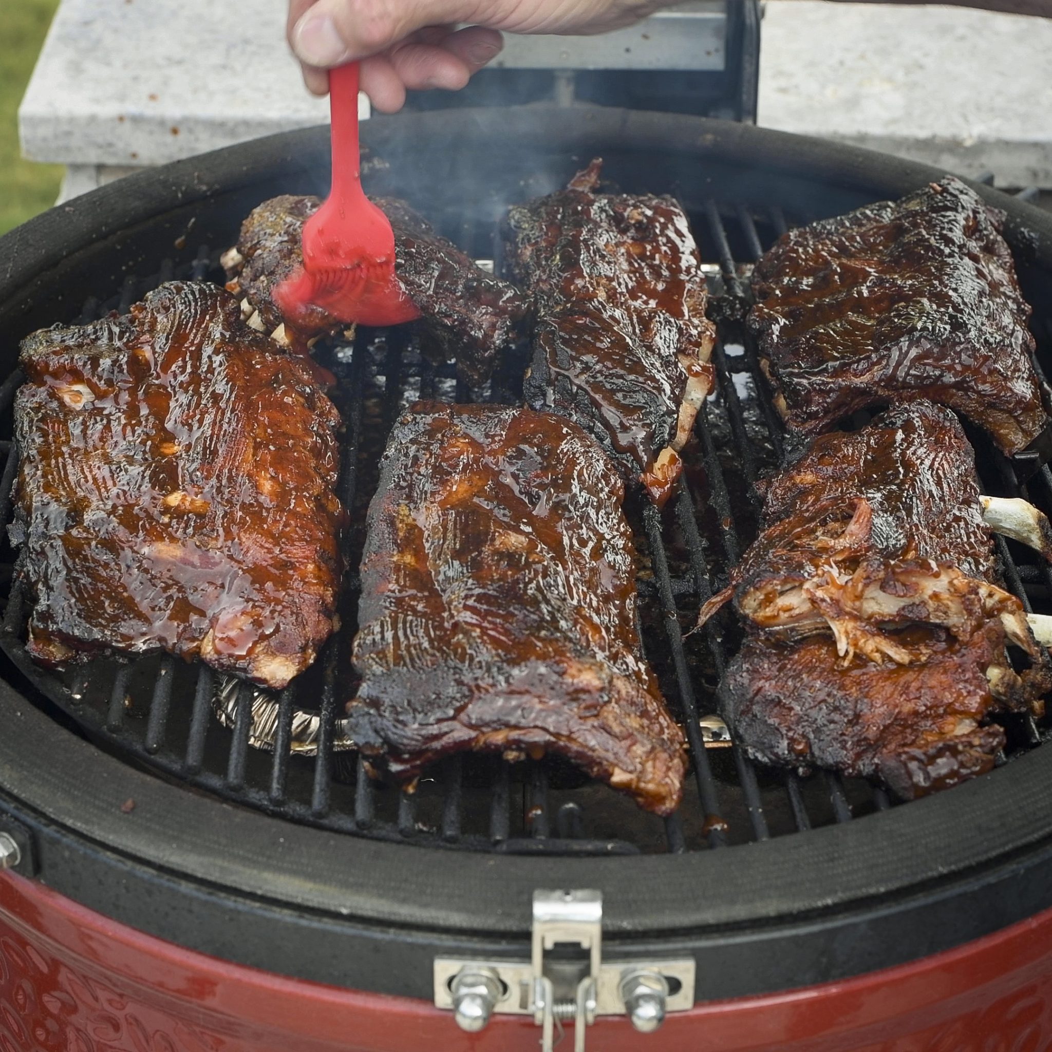 Ribs cooking on a Kamado Joe.