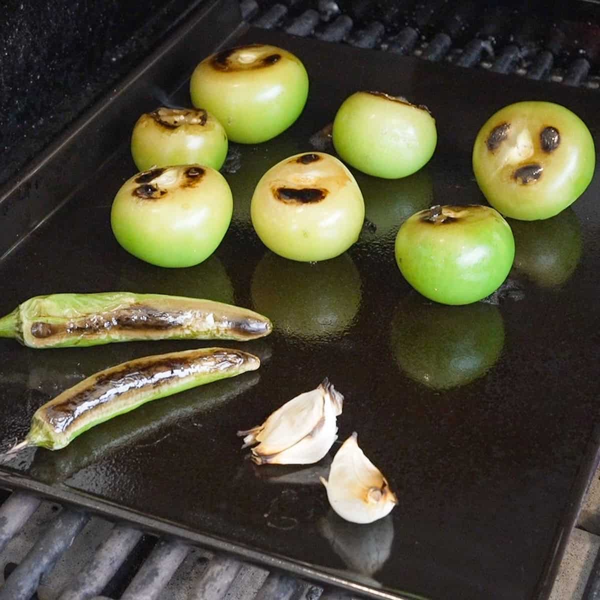 Roast the vegetables for the salsa verde.