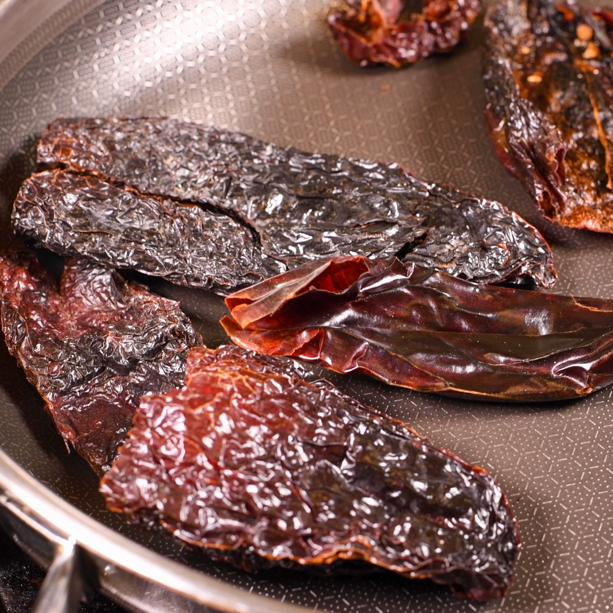 Roast chiles in a hot skillet.