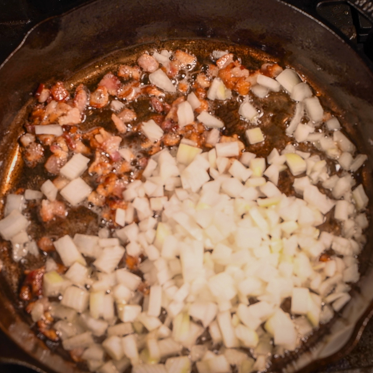 Cook onion and bacon.