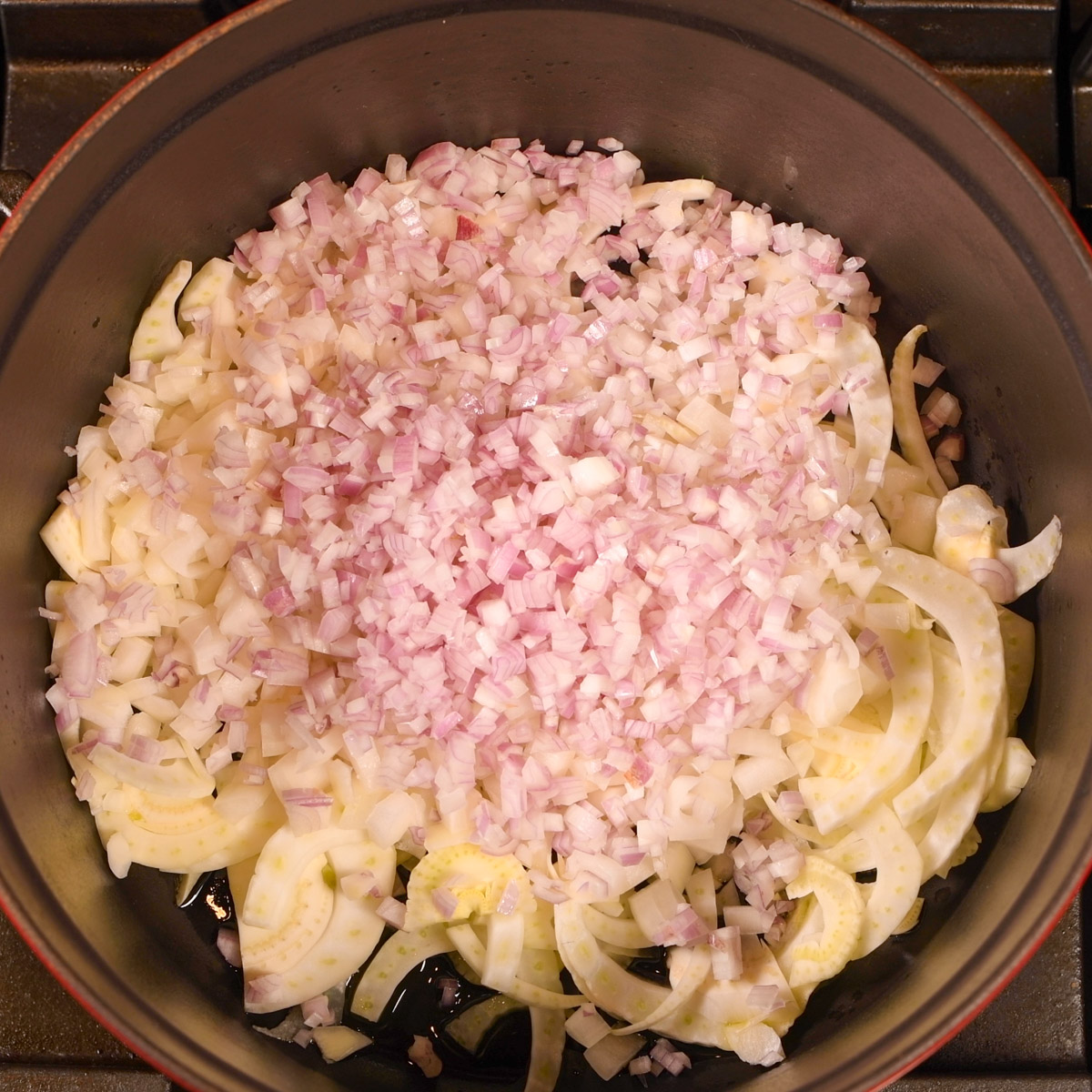 Saute shallots and fennel in a Dutch oven.