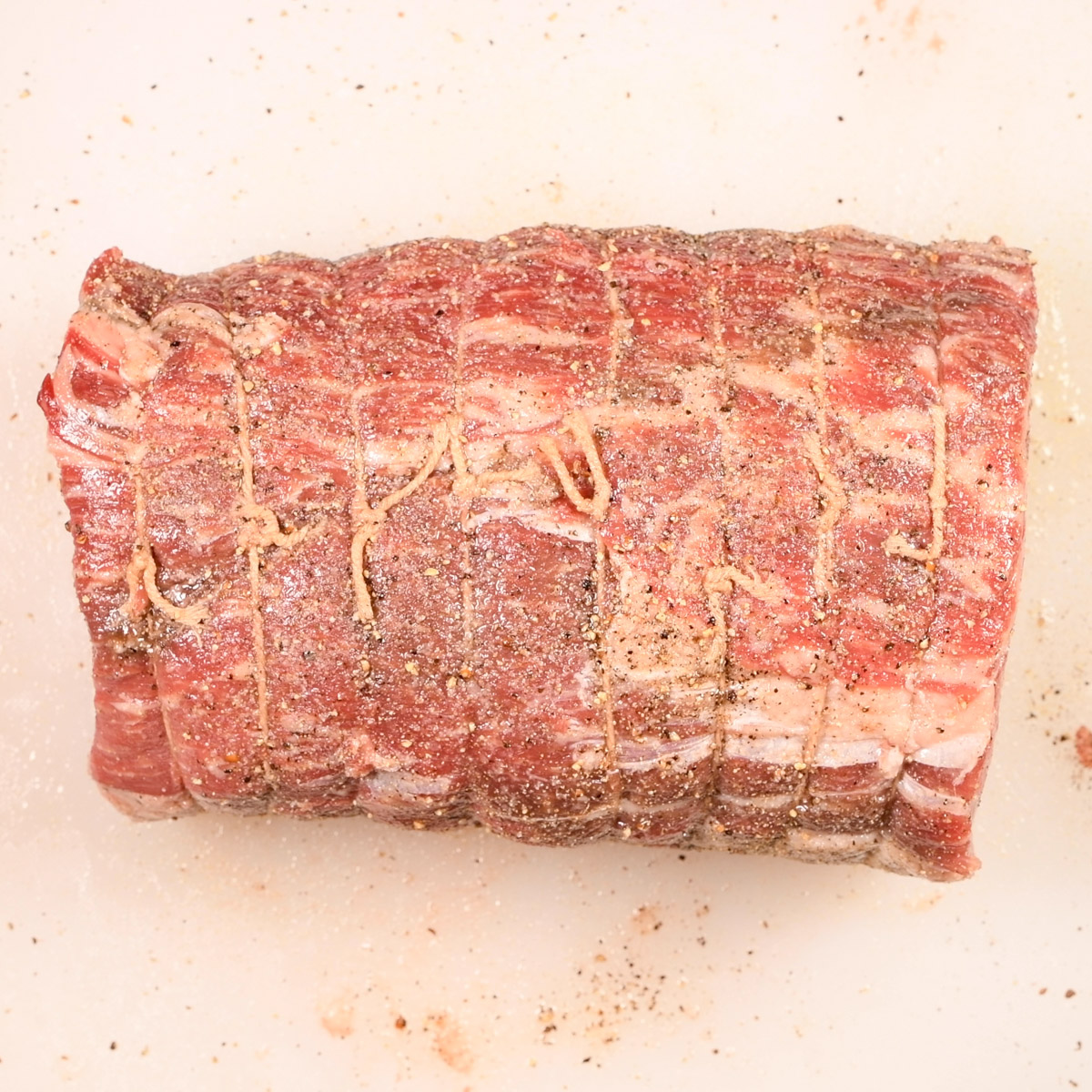 Season the roast with salt, pepper and garlic powder.