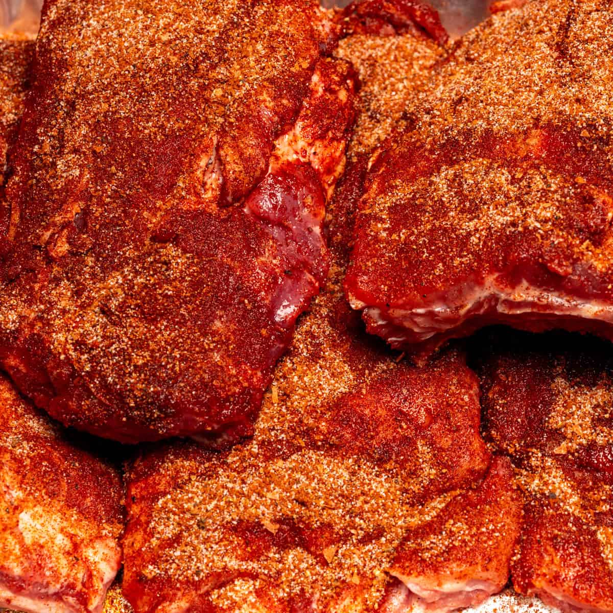 Season the ribs with dry rub.