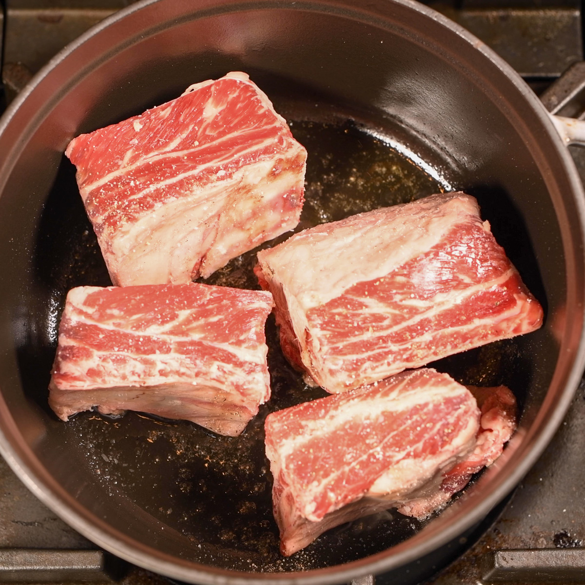 Sear short ribs in a Dutch oven.