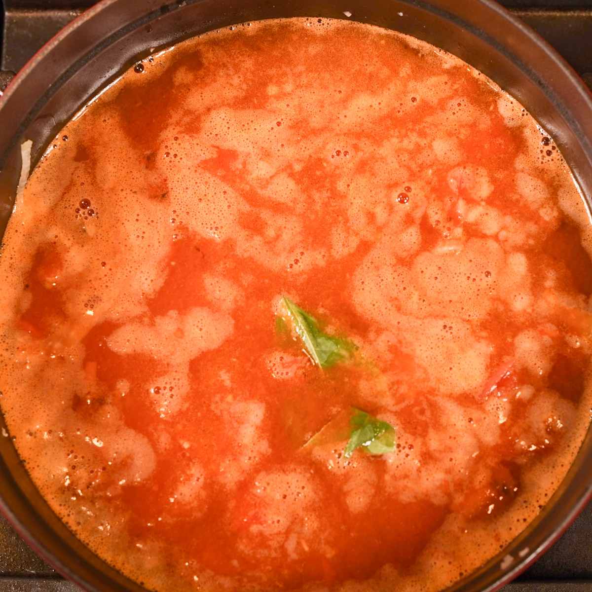 Add white wine and seafood stock and simmer for 30 minutes.