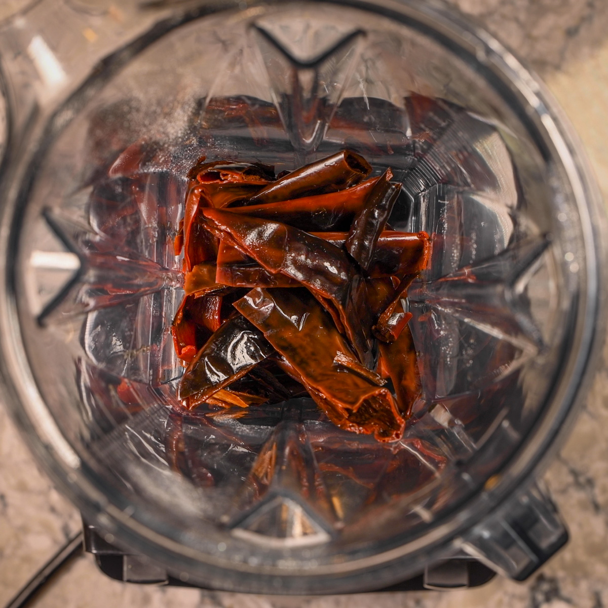 Place soaked chiles in a blender.