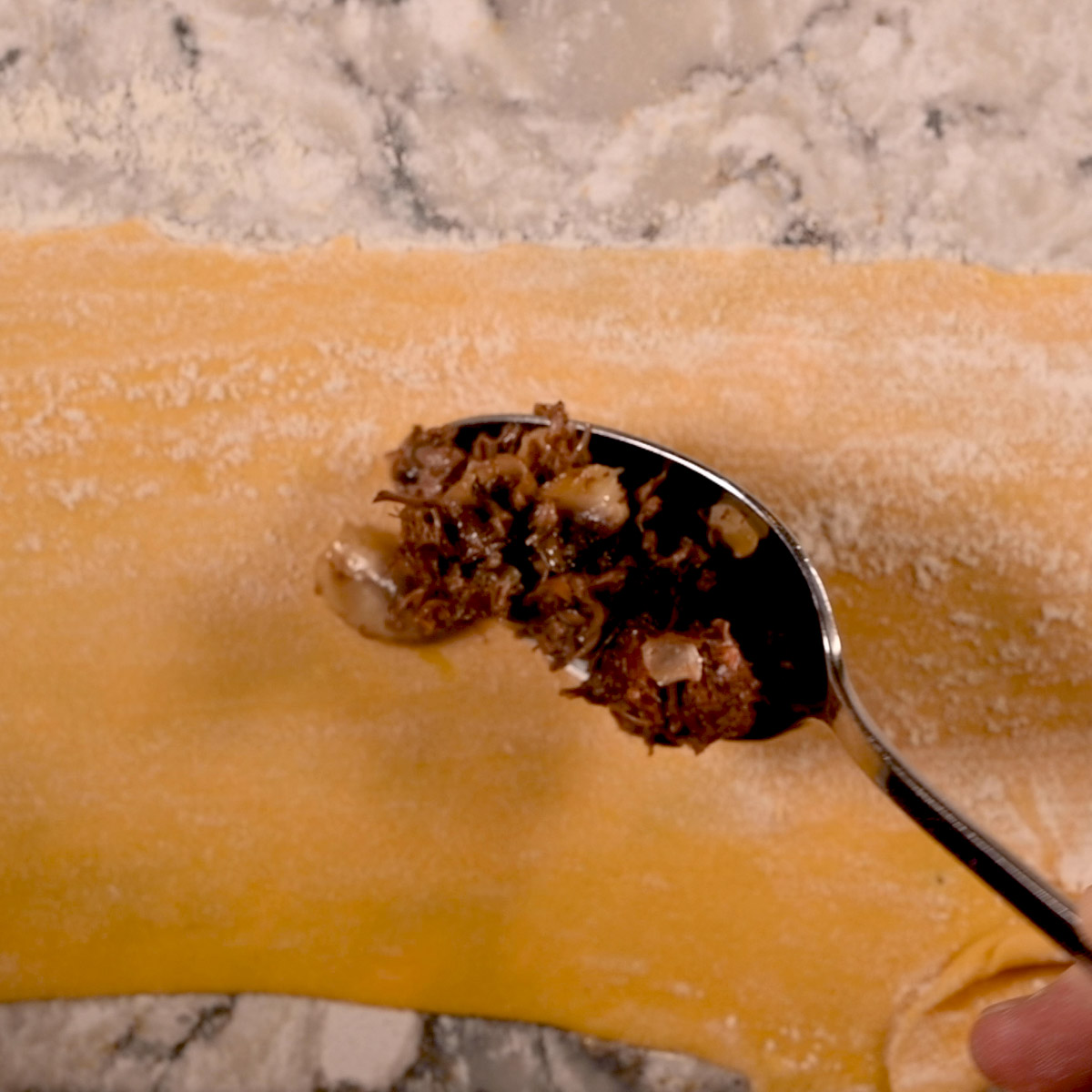 Add a tablespoon of mushroom mixture to the bottom pasta.