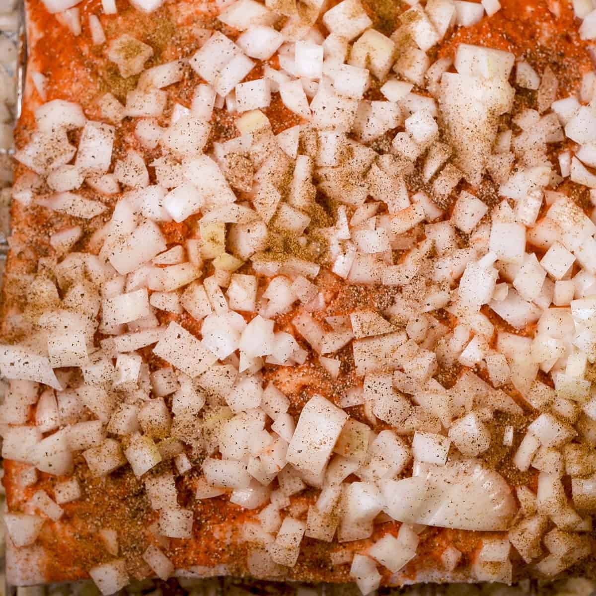 Add minced onion on top of pork belly.