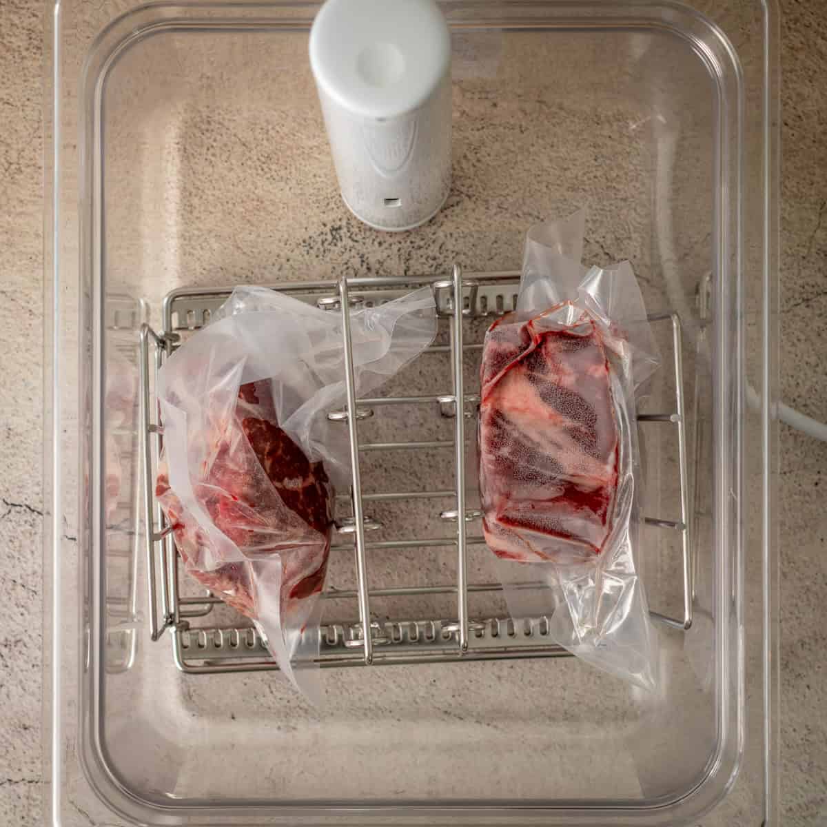 Steaks in a sous vide bath.