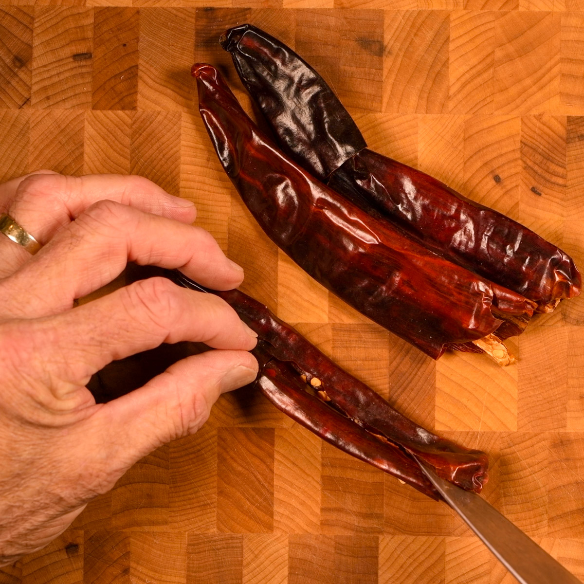 Stem and seed the dried chiles.