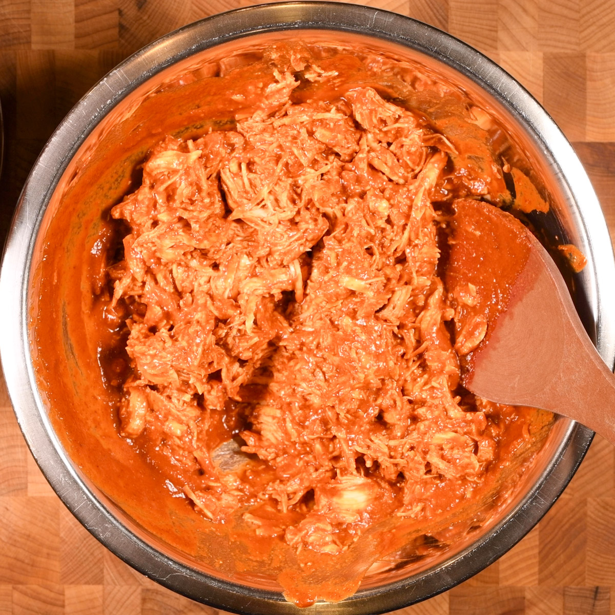 Stir the birria sauce and chicken until combined.