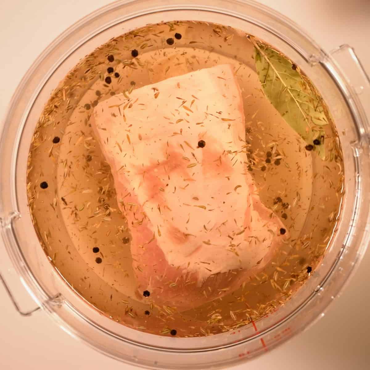 Submerge the pork loin in the wet brine.