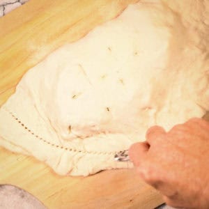Trim the calzone.