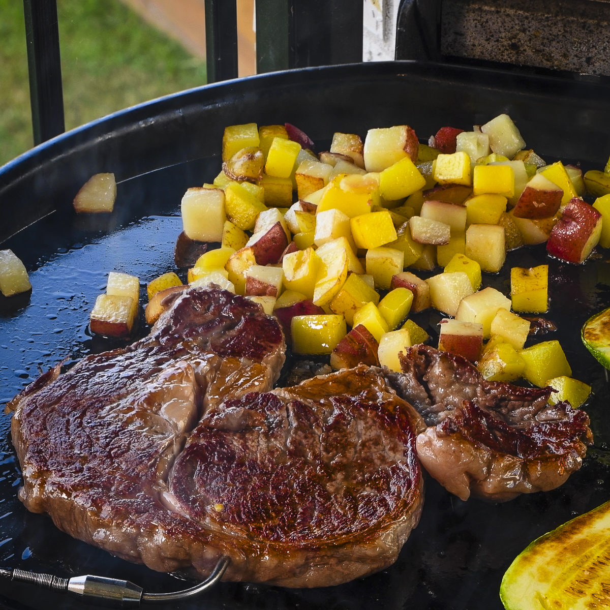 Wagyu ribeye cooking on the griddle.