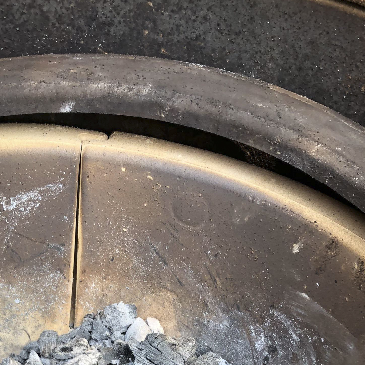Warped firebox retaining ring in a Kamado Joe.