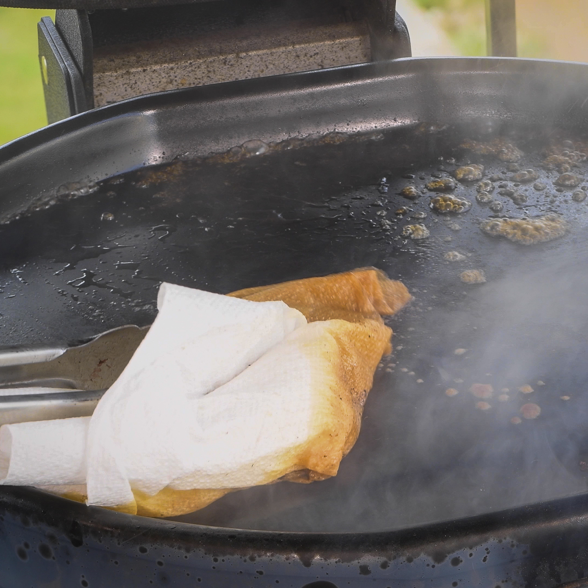 Clean the griddle with wet paper towels while it is still warm.