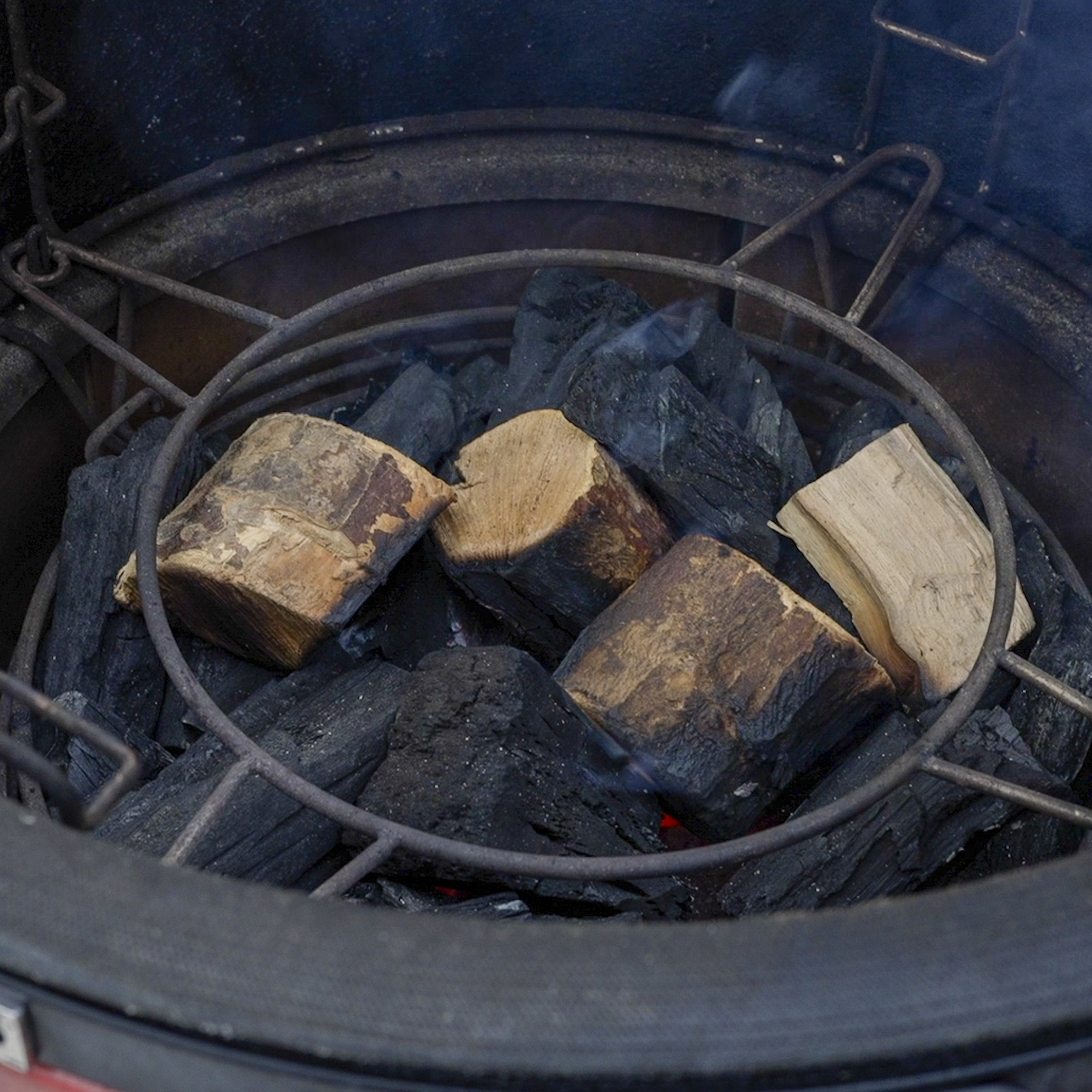 Chunks of apple wood on lump charcoal.